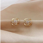 Mélodie - Boucles d'oreilles dorées en spirale avec cristaux
