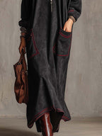 Manon | Robe longue noire à surpiqûres contrastées et poches plaquées